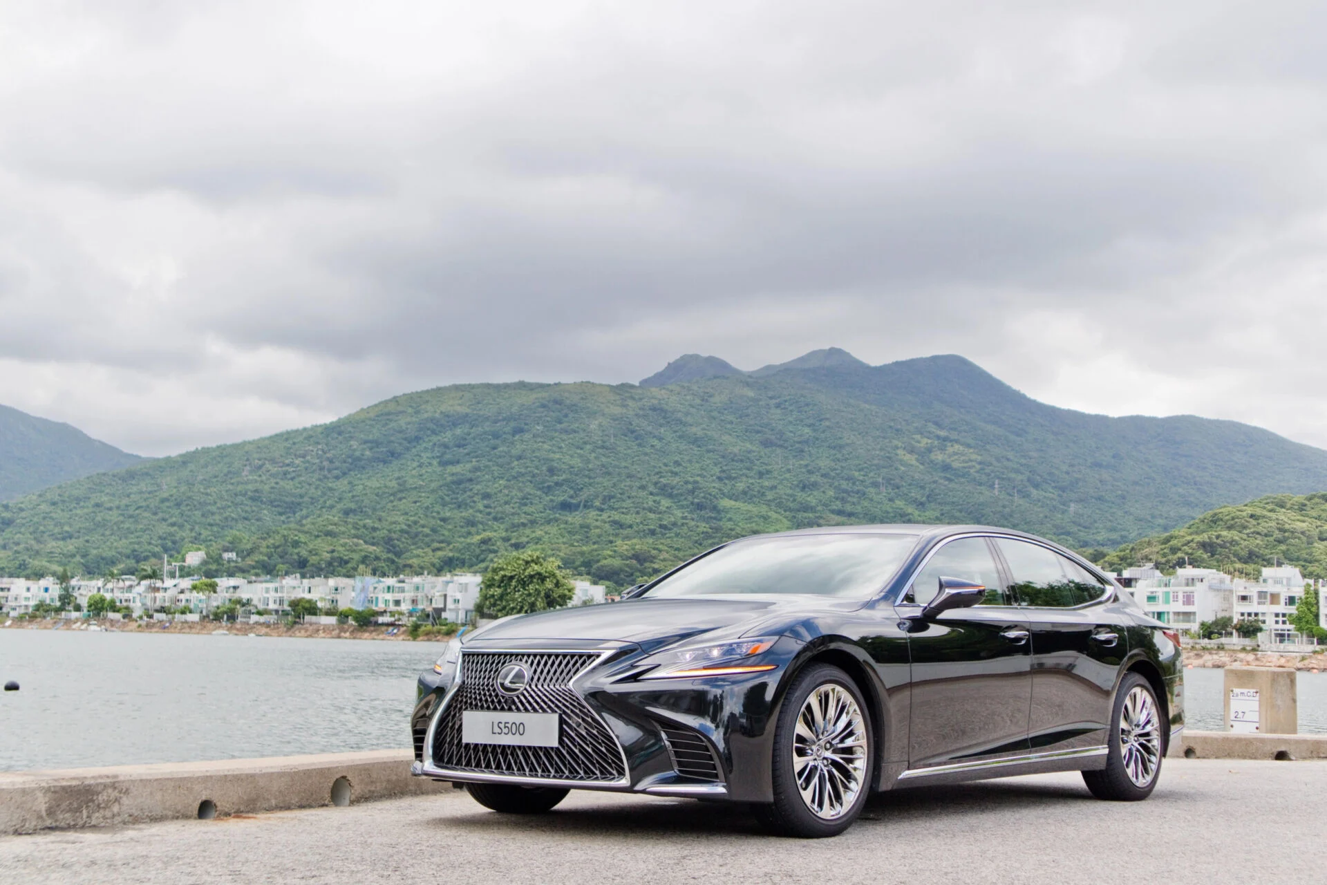 Lexus parked in front of mountain view