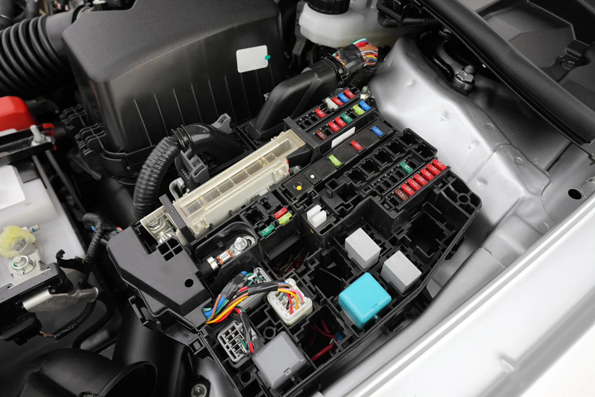 Car engine bay fuse box.