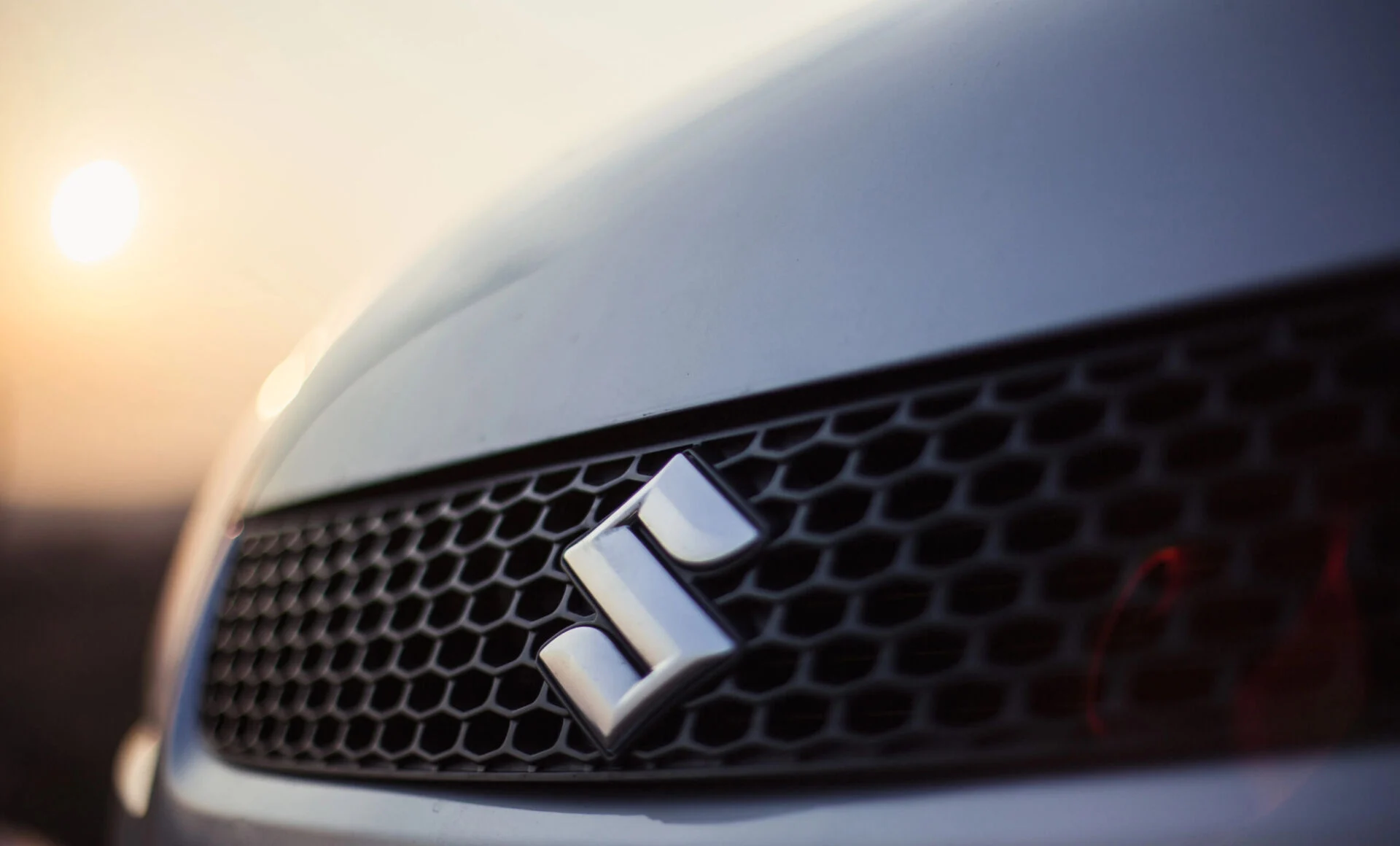 Suzuki logo on the front of a vehicle