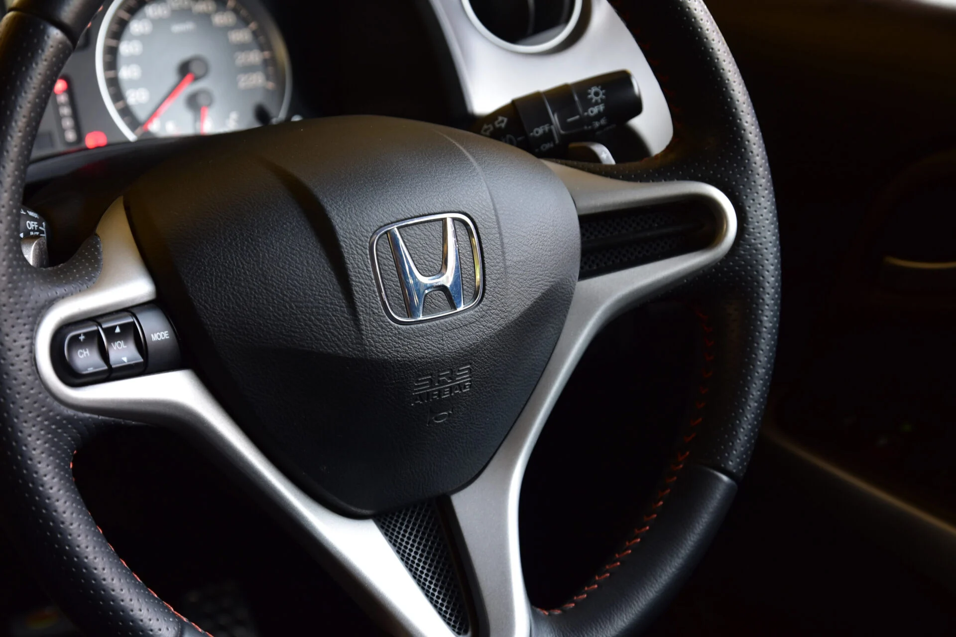 The steering wheel of a Honda vehicle