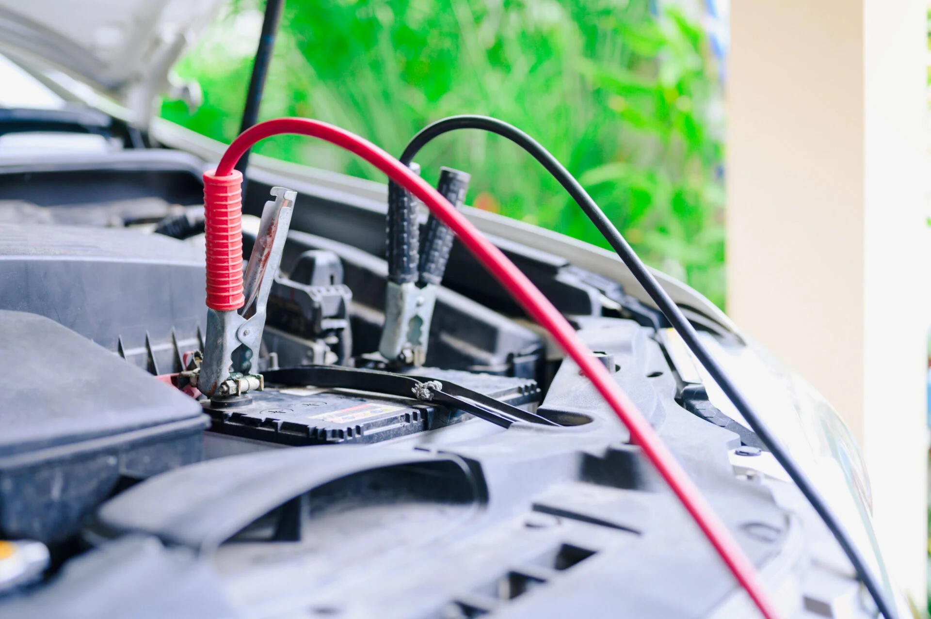 Closeup of a car battery being jump started
