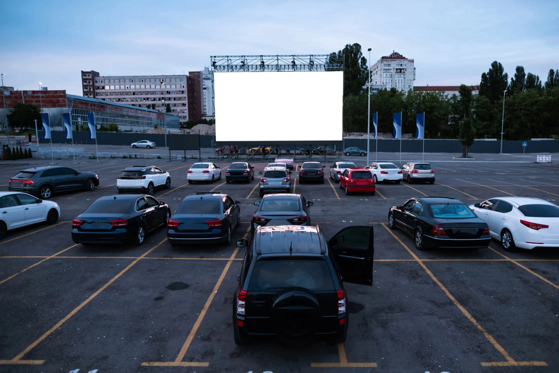 Cars in parking lot at drive in theatre