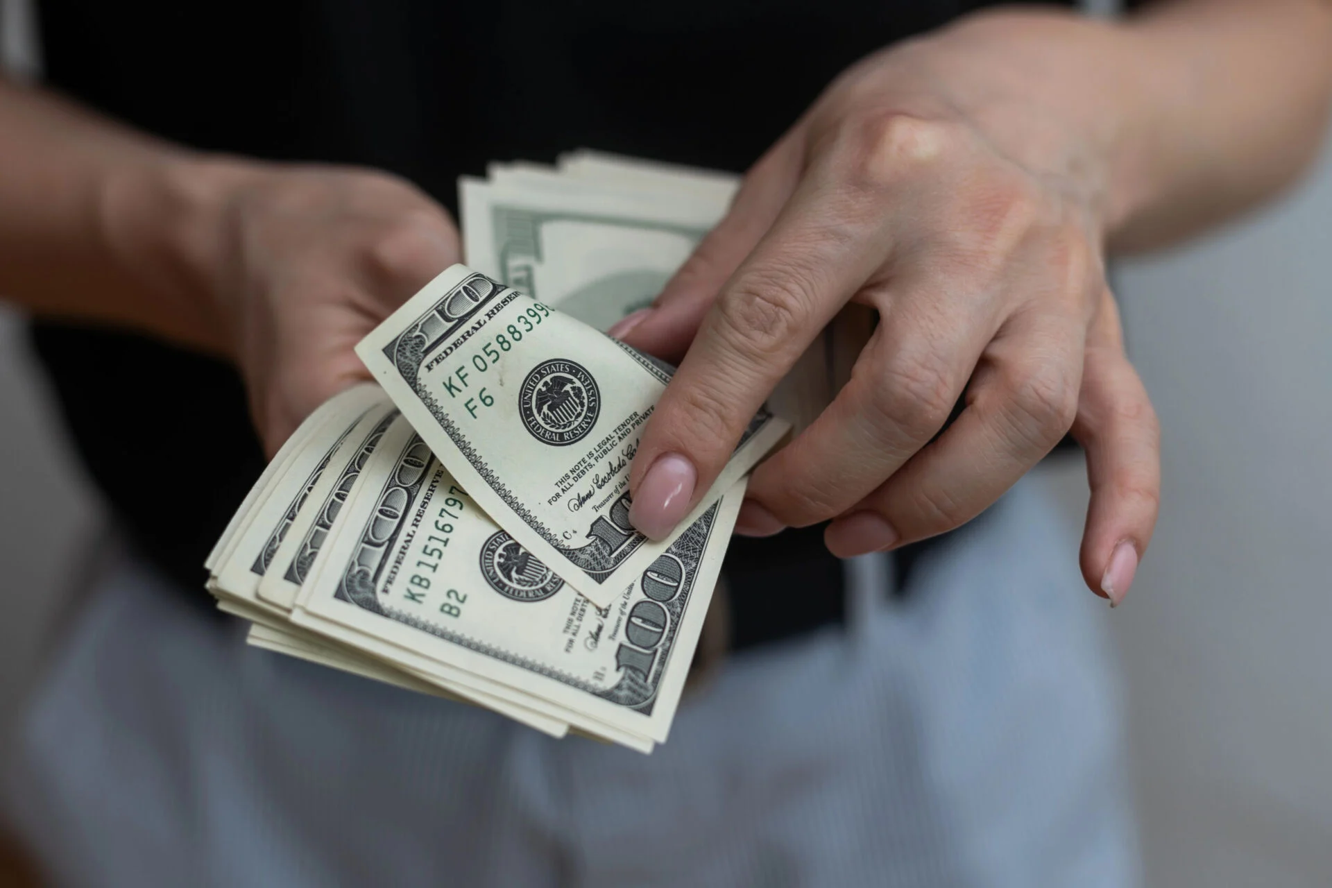 Up close of man counting US cash