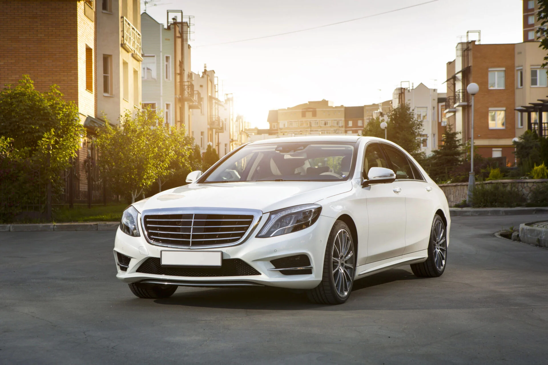 White Mercedes-Benz at sunset
