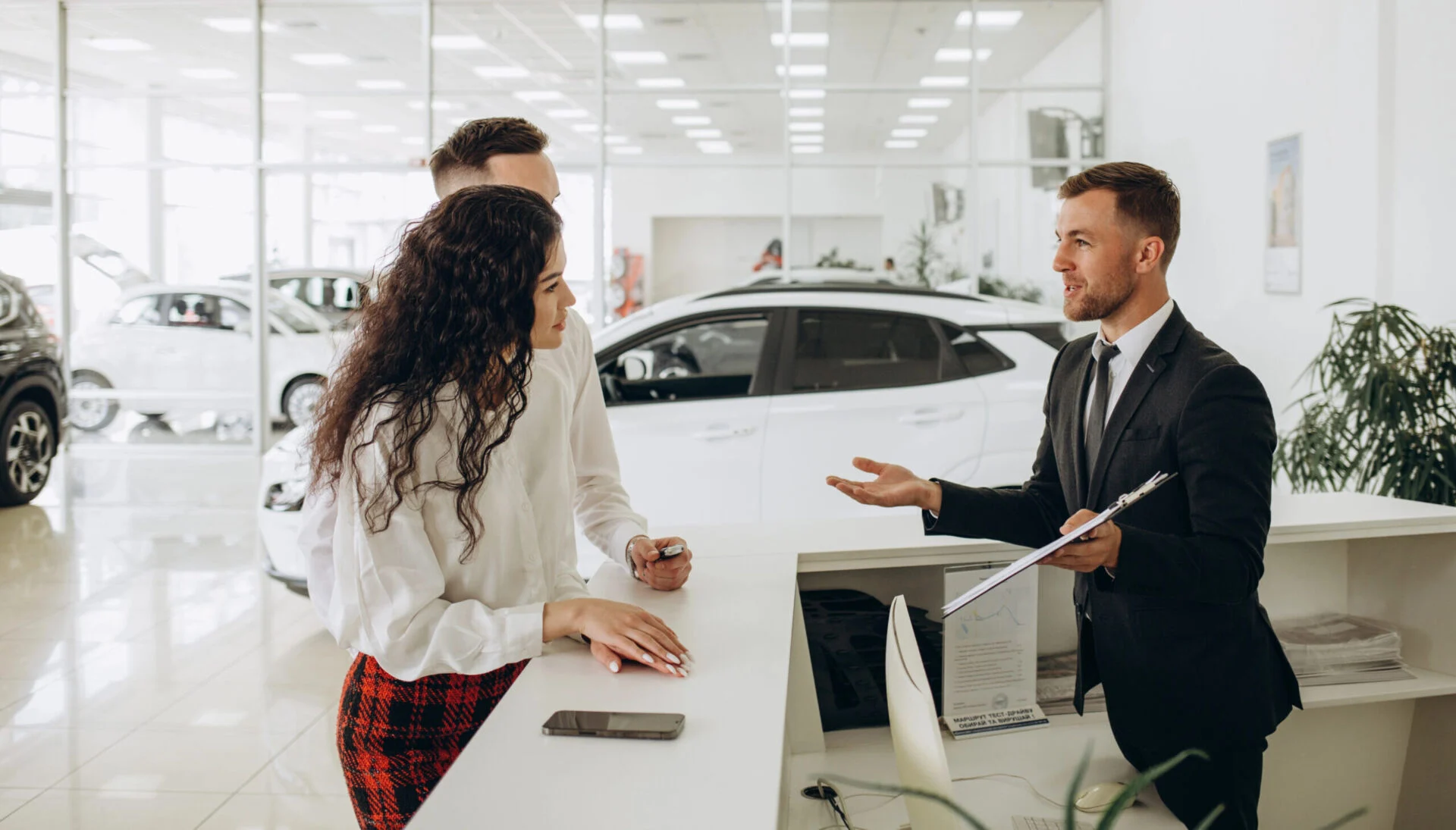 Car salesman at desk