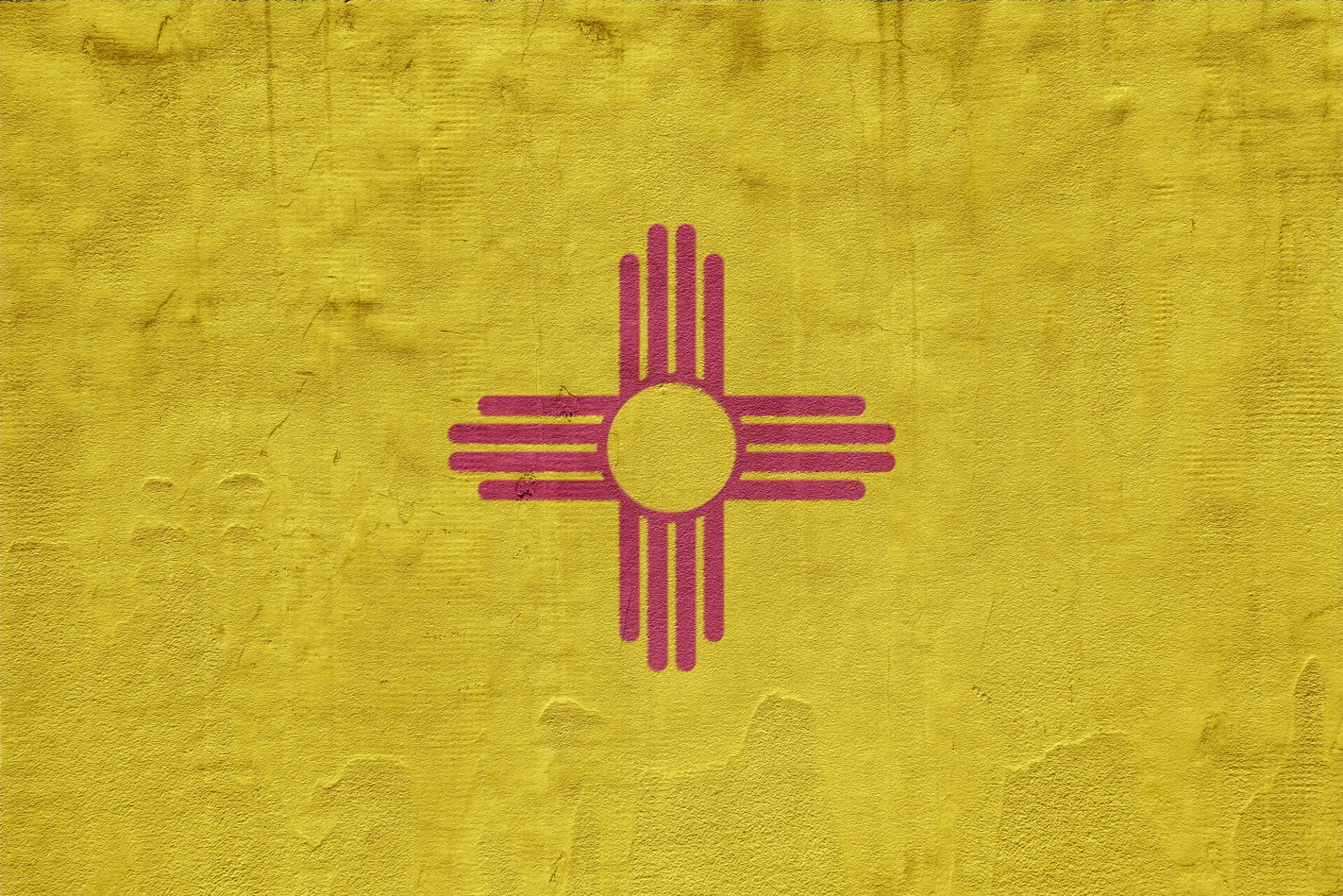 Flag of New Mexico state USA on a textured background.