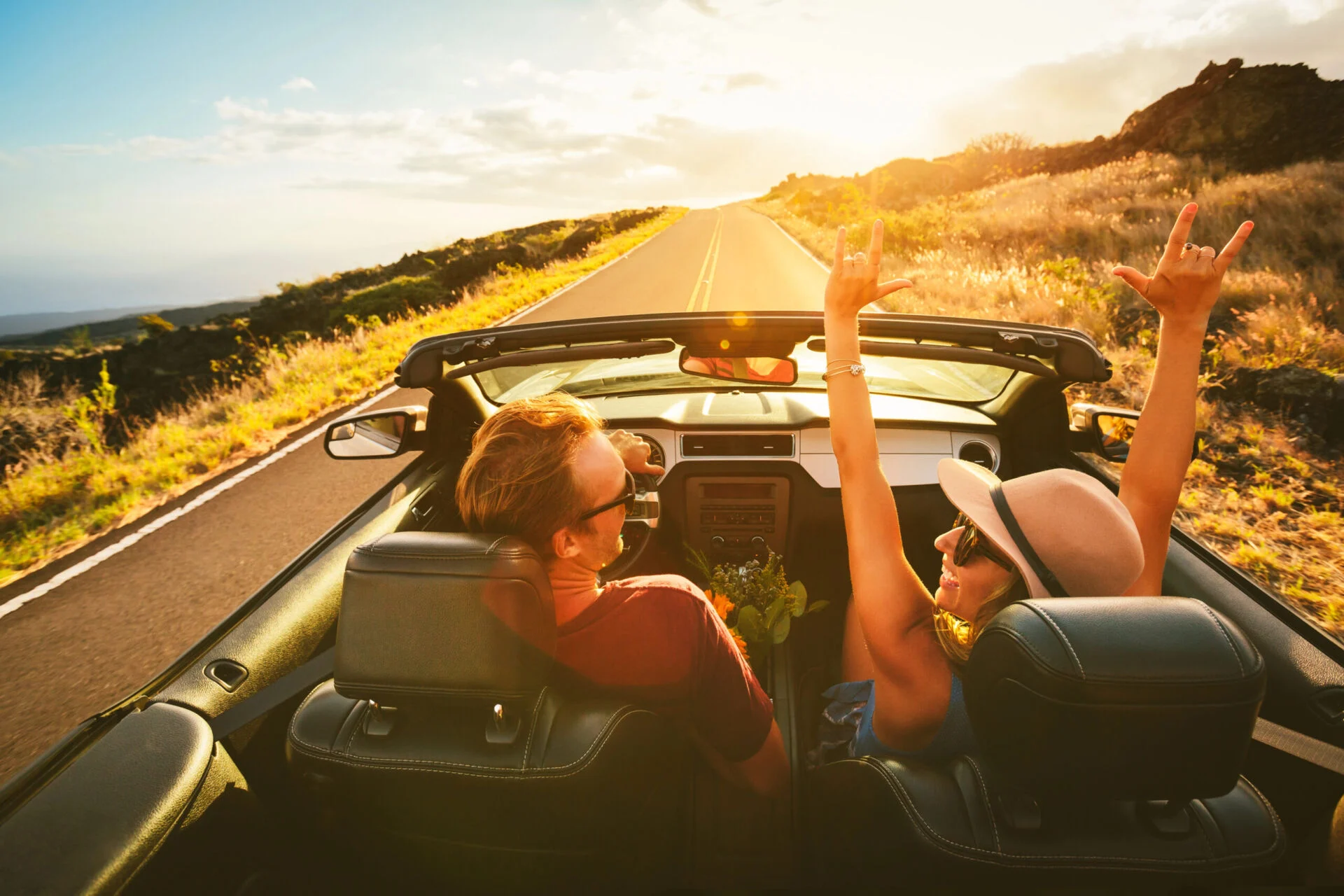 Couple on a road trip during sunset